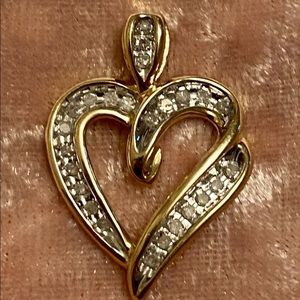 Real Diamond heart pendant in 14k yellow gold.